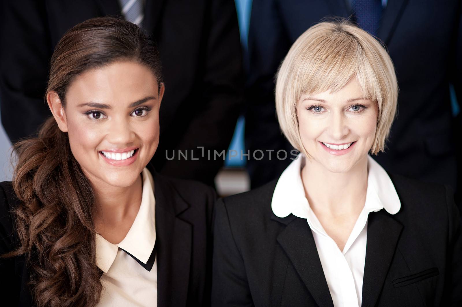 Beautiful business women posing together