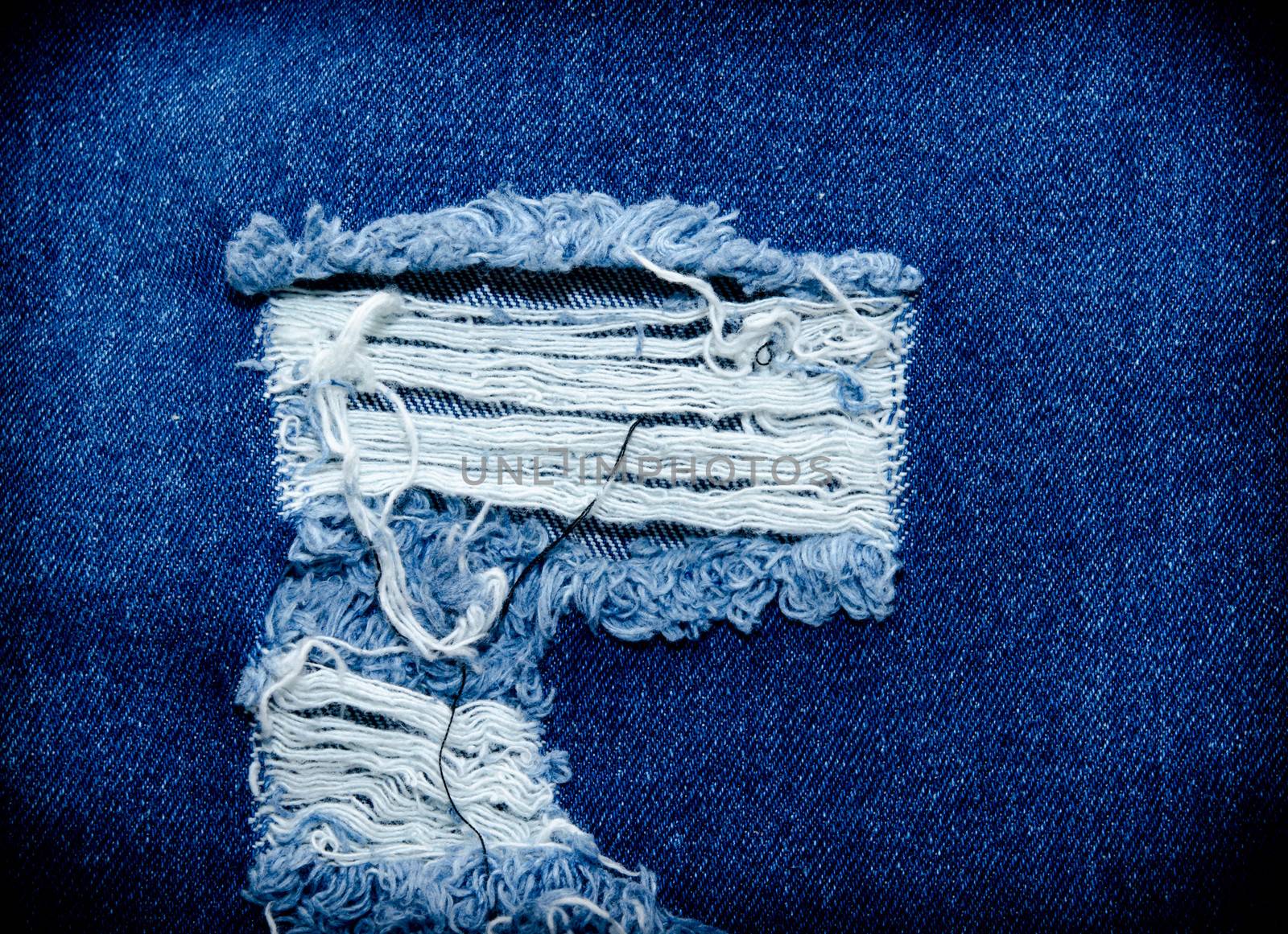 Blue jeans. I have a torn white yarn.