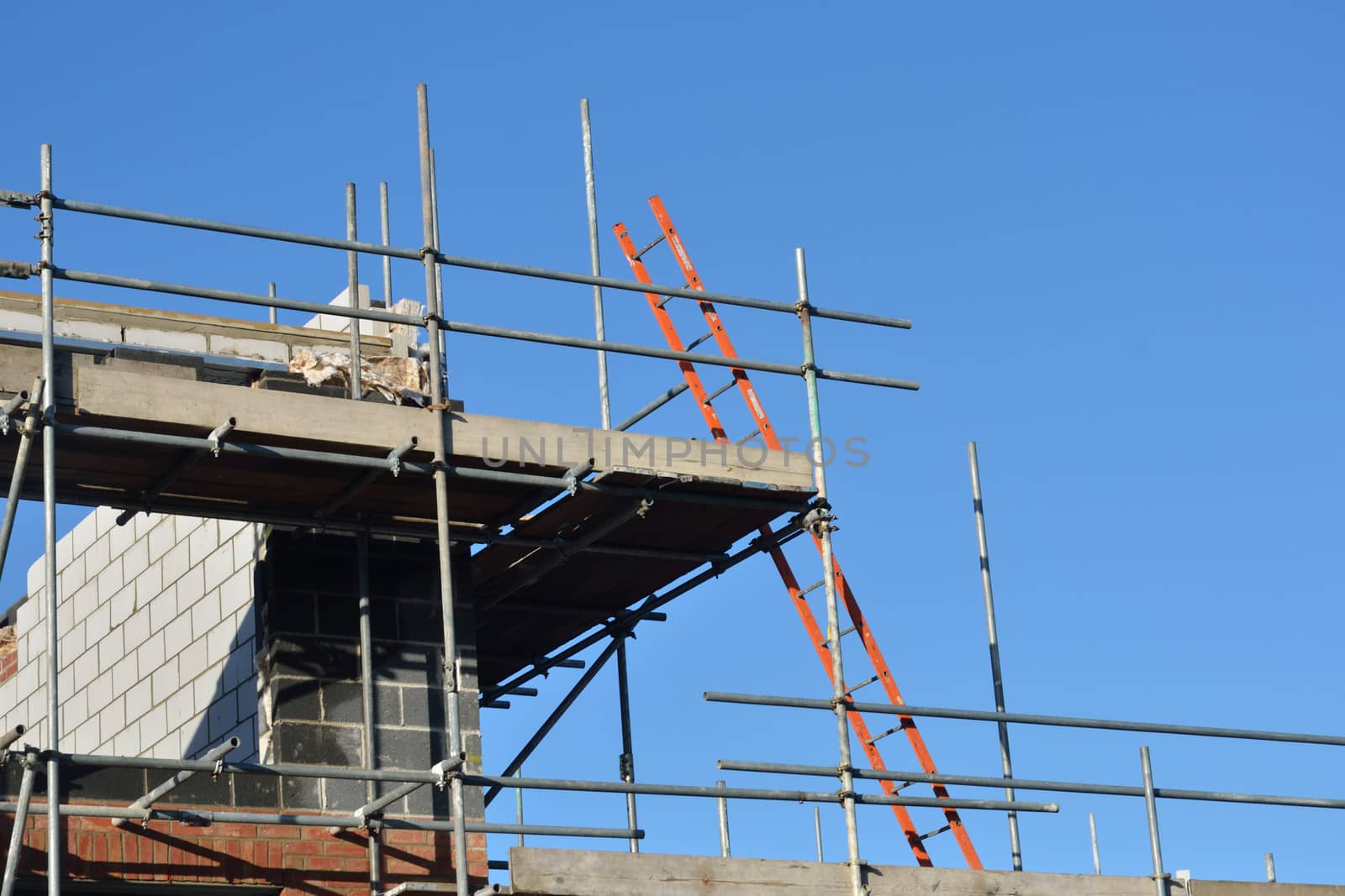 Construction site with ladder and scaffolding