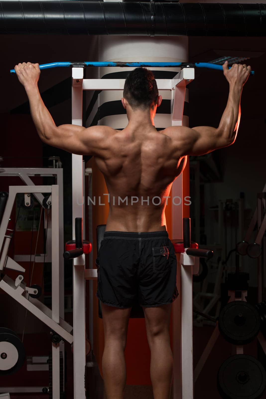 Young Man Doing Exercise For Back by JalePhoto