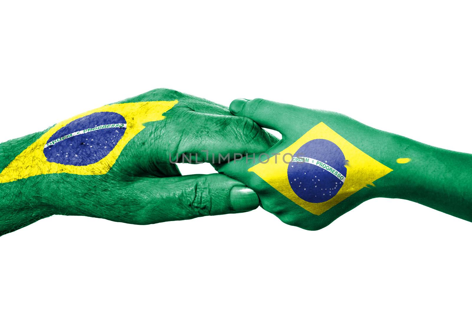 Two hands and Brazilian flag. Old and young hands