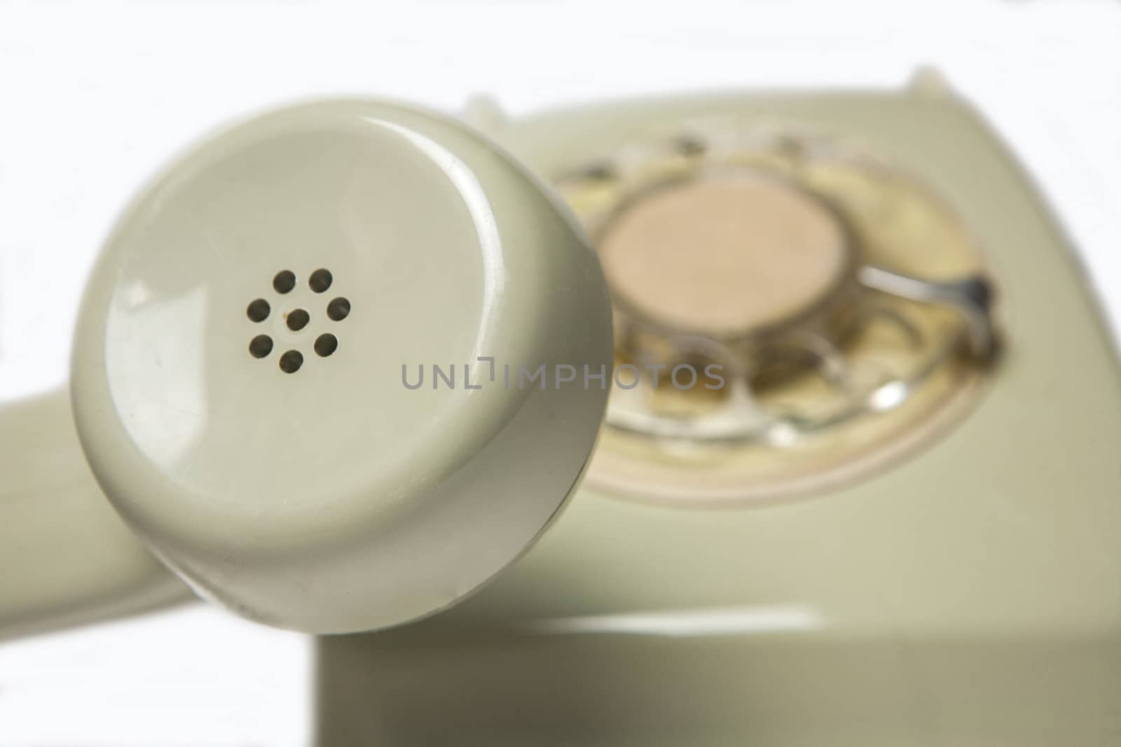 Vintage telephone receiver isolated on white background 