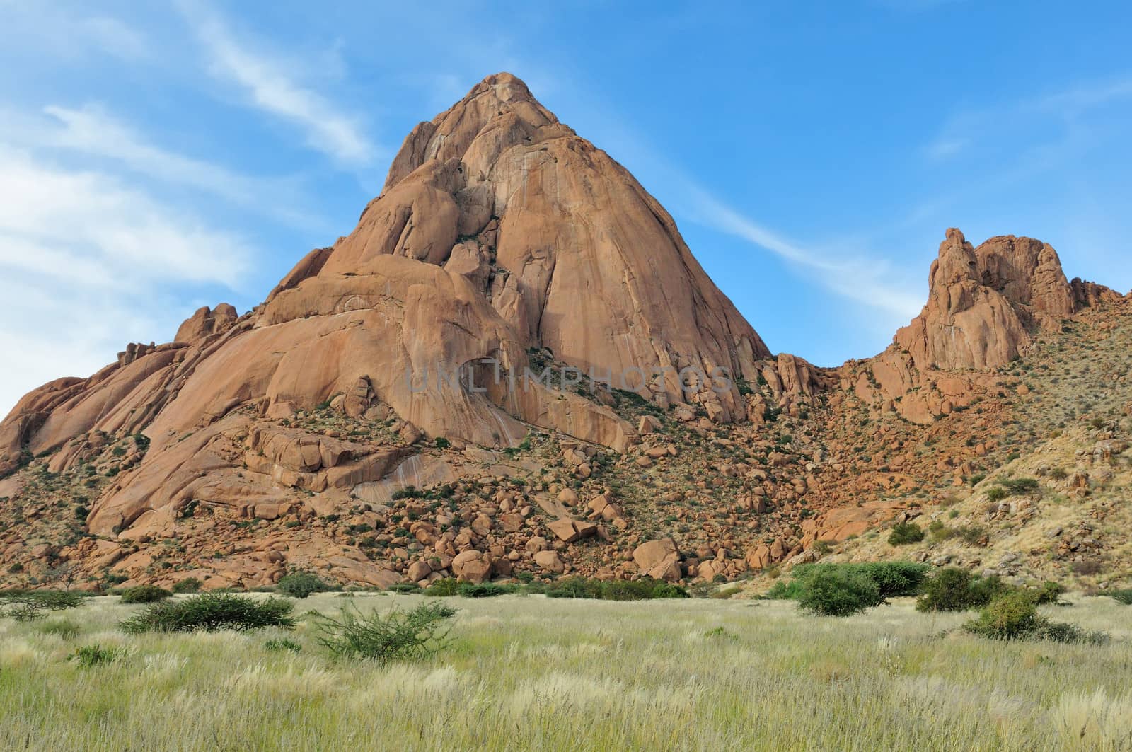 Greater Spitzkoppe, Namibia with grass field in the foreground