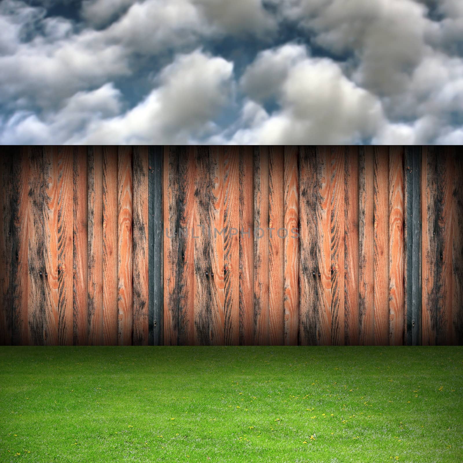 beautiful garden backdrop with old wooden fence on cloudy day