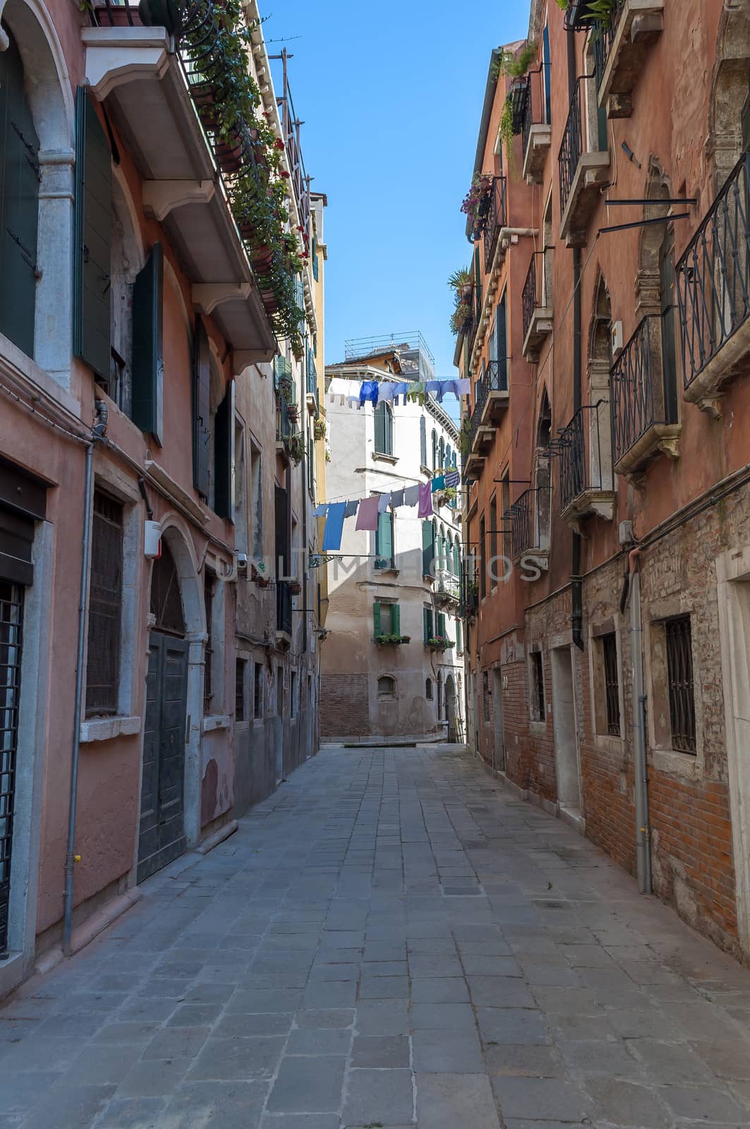 Residential buildings along quiet street in Venice, Italy.
