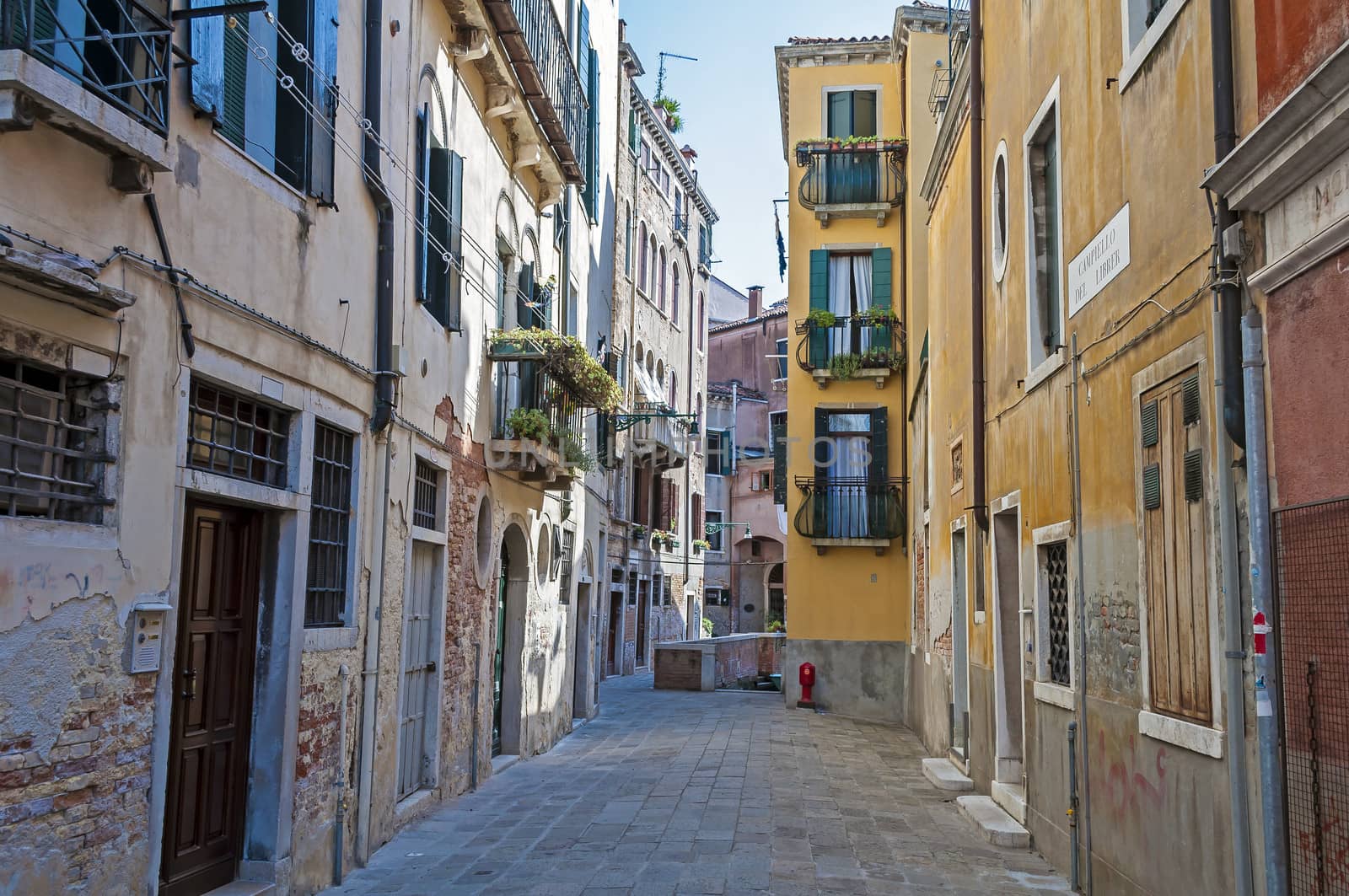 Residential buildings along quiet street in Venice, Italy.