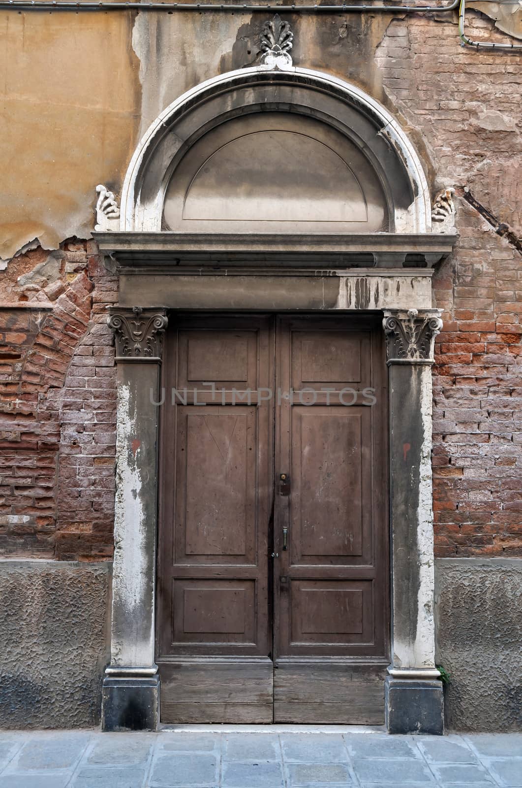 Old door in the city of Venice, Italy.