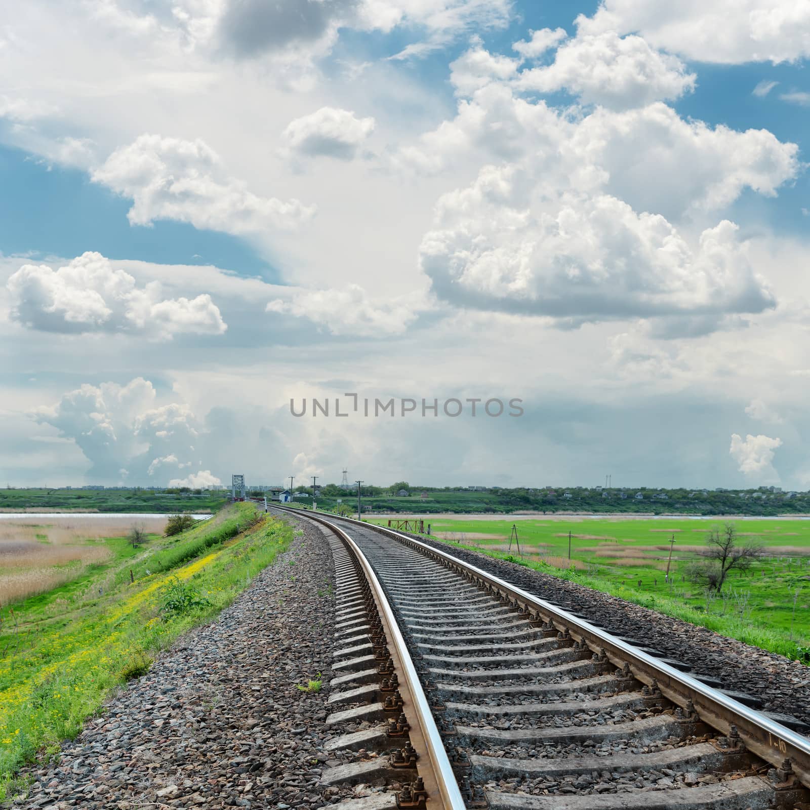 railroad to horizon and cloudy sky