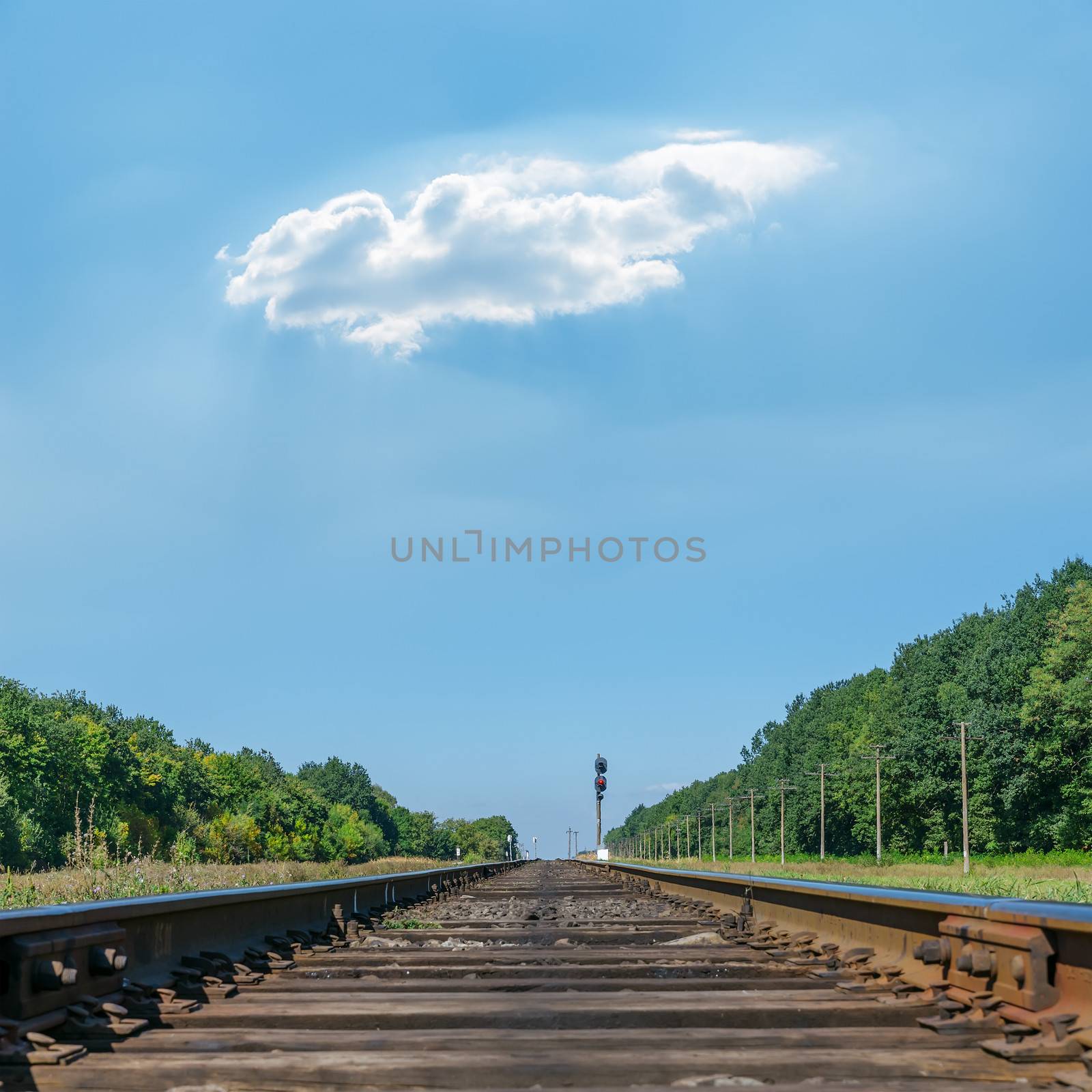 one cloud over railroad to horizon