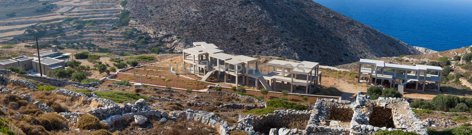 Construction site on the hills , new buildings under construction on the hills from folegandros, Greece, 2013.