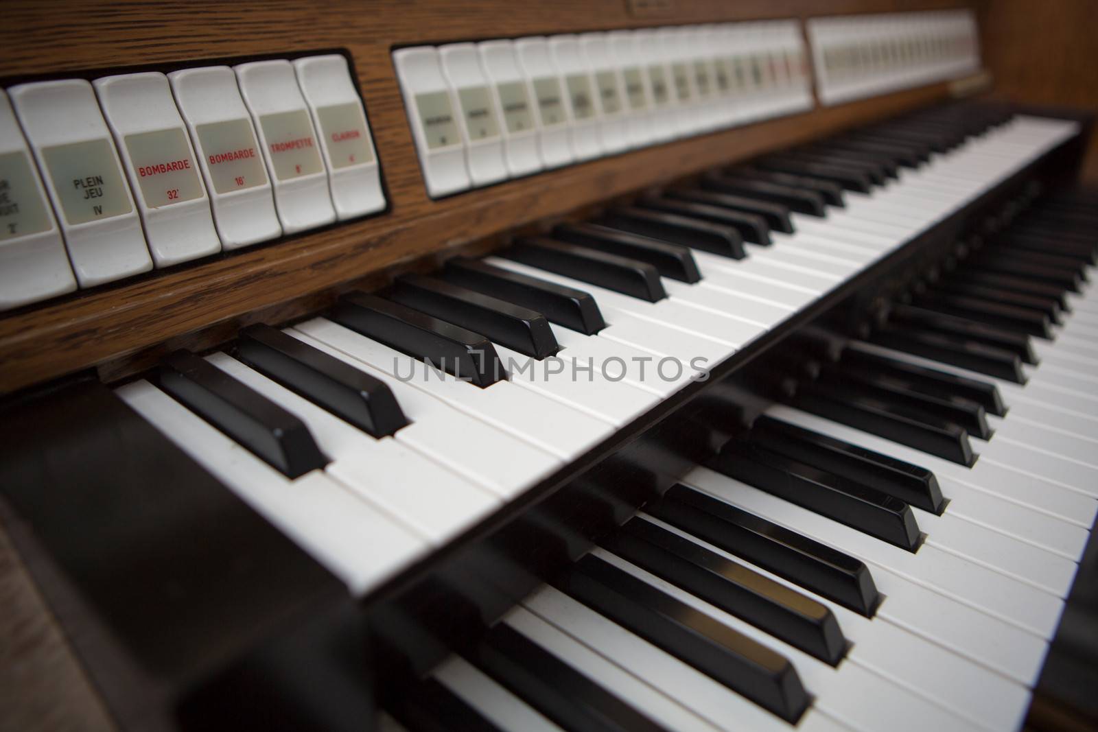 Close up view of a church organ in Lourdes, 2013. The organ is a musical instrument commonly used in churches or cathedrals.