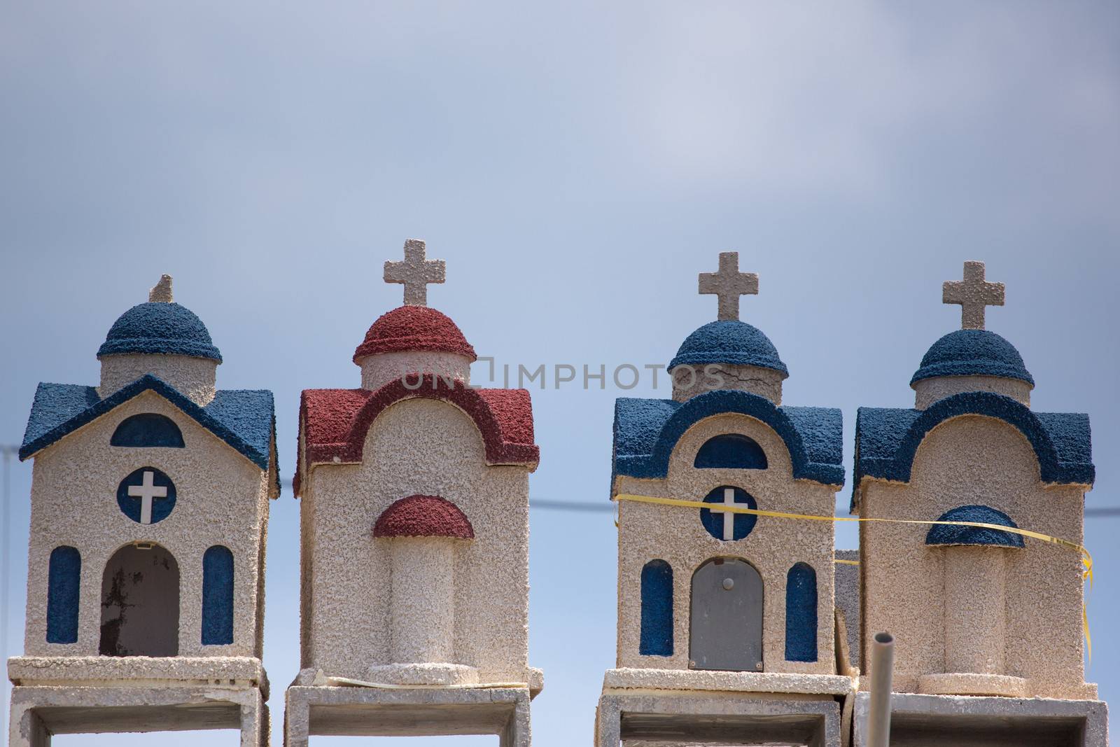 Little colorful orthodox temples in Crete, Greece, 2013.