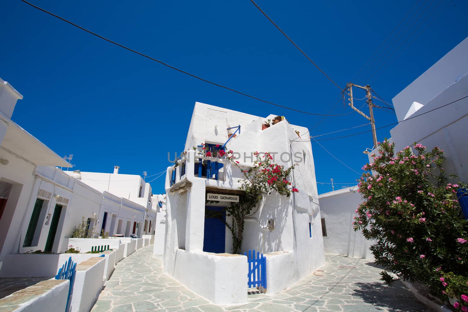 Typical traditional greek white and blue houses on the island of Folegandros. In most of the Cycladic islands, houses were painted white to reflect the harsh summer sun, Greece, 2013.