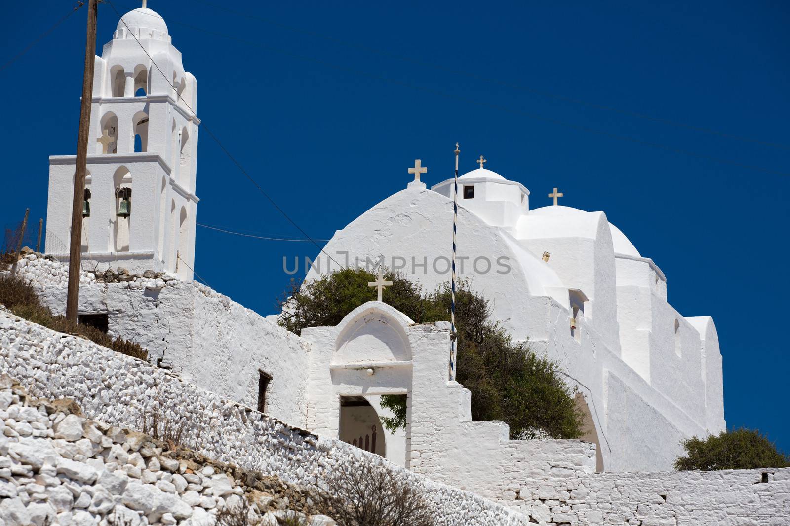 Close up from the facade and entrance of the  Gorgeous white orthodox church of Panagia of Chora, Island of Folegandros , Aegean sea. Greek 2013.