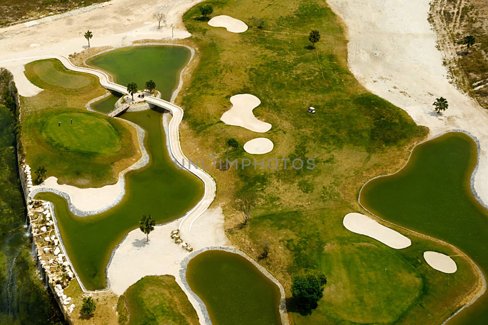 Flying above a golf course at an exotic destination