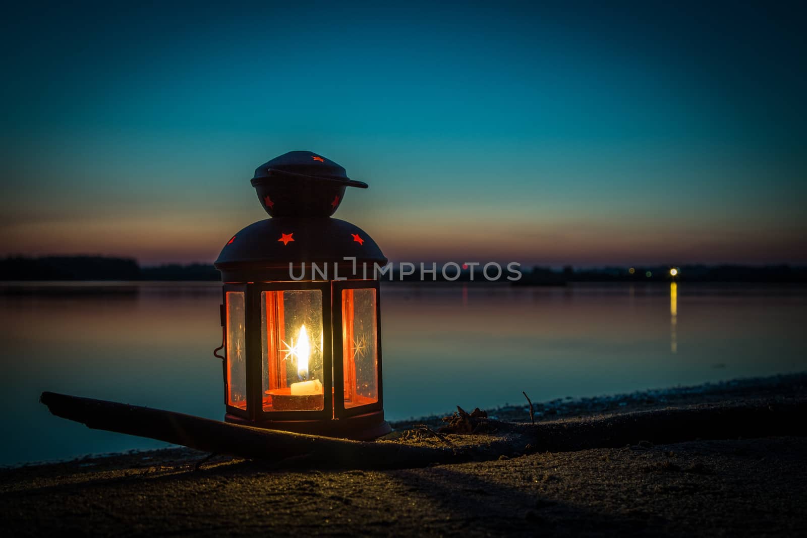 Lantern on the beach at the lake
