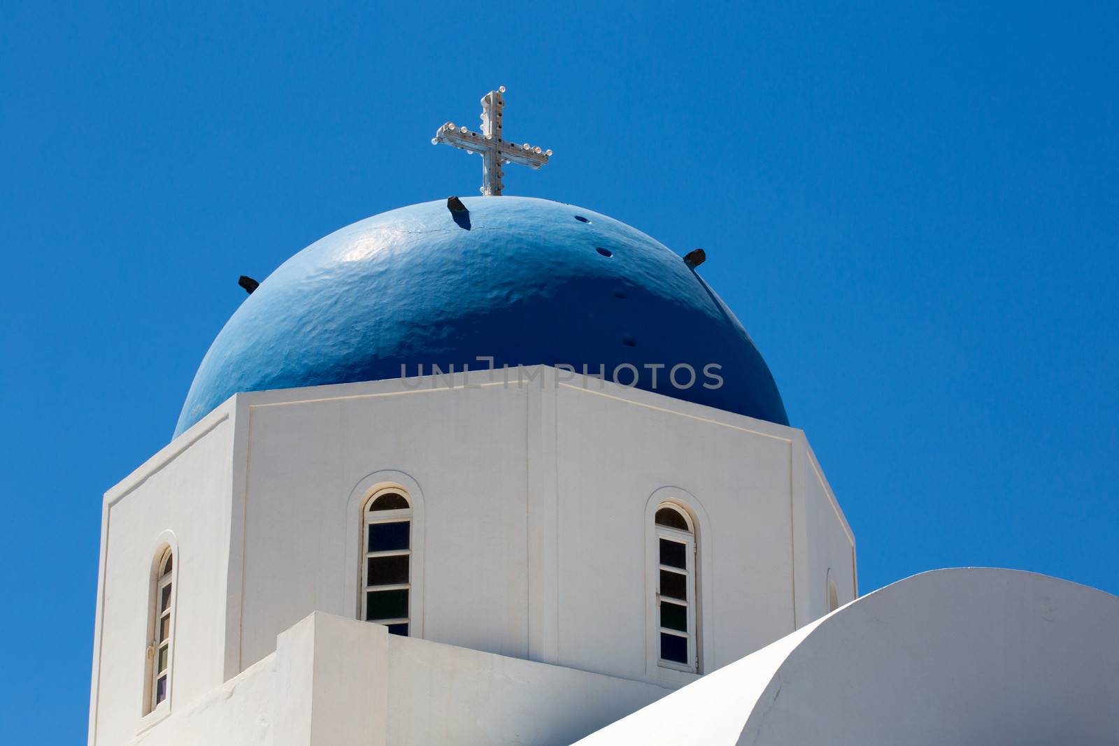 The beautiful 18th century church and its distinctive blue domed tower is the symbol of the Island of Santorini.Agiou Mina Church. Santorini, Greece, 2013.