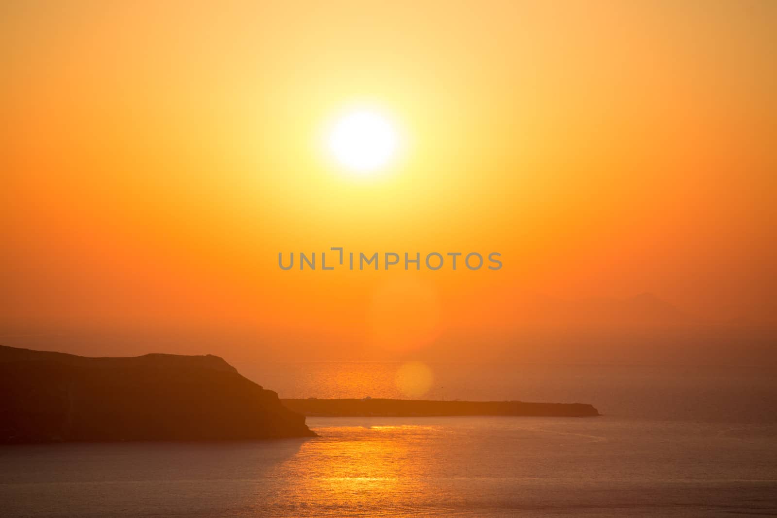 Beautiful sunset at the beach of Santorini in Greece, June, 25, 2013.