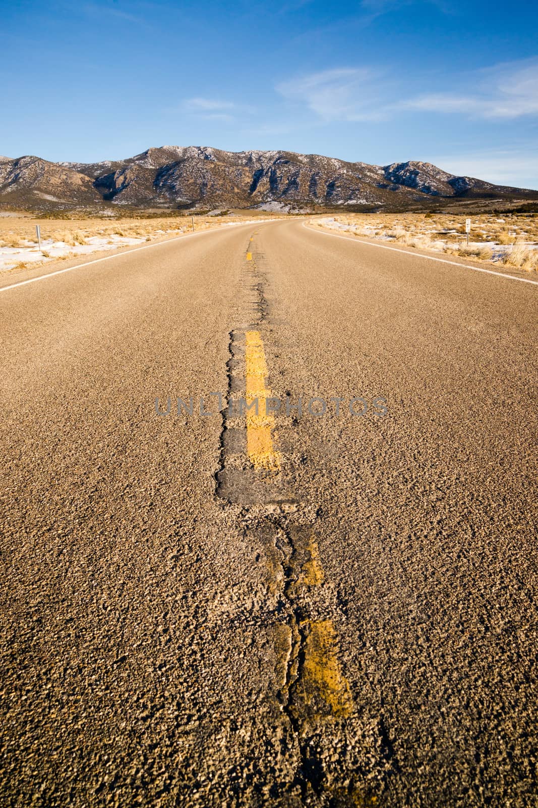 Blue Sky Worn Mountain Road Desert Travel Asphalt by ChrisBoswell