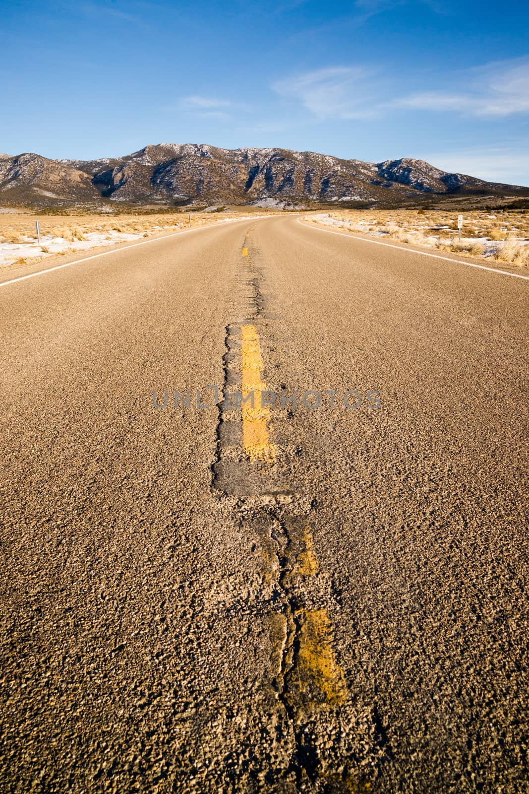 Vertical blue sky two lane road southwest landscape