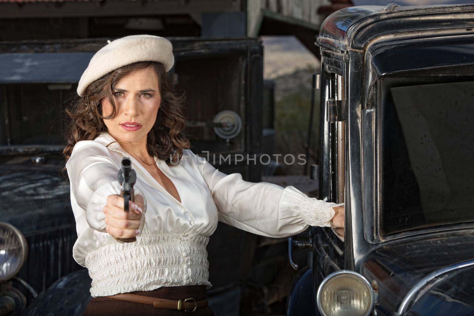 Tough Woman Holding Gun by Creatista