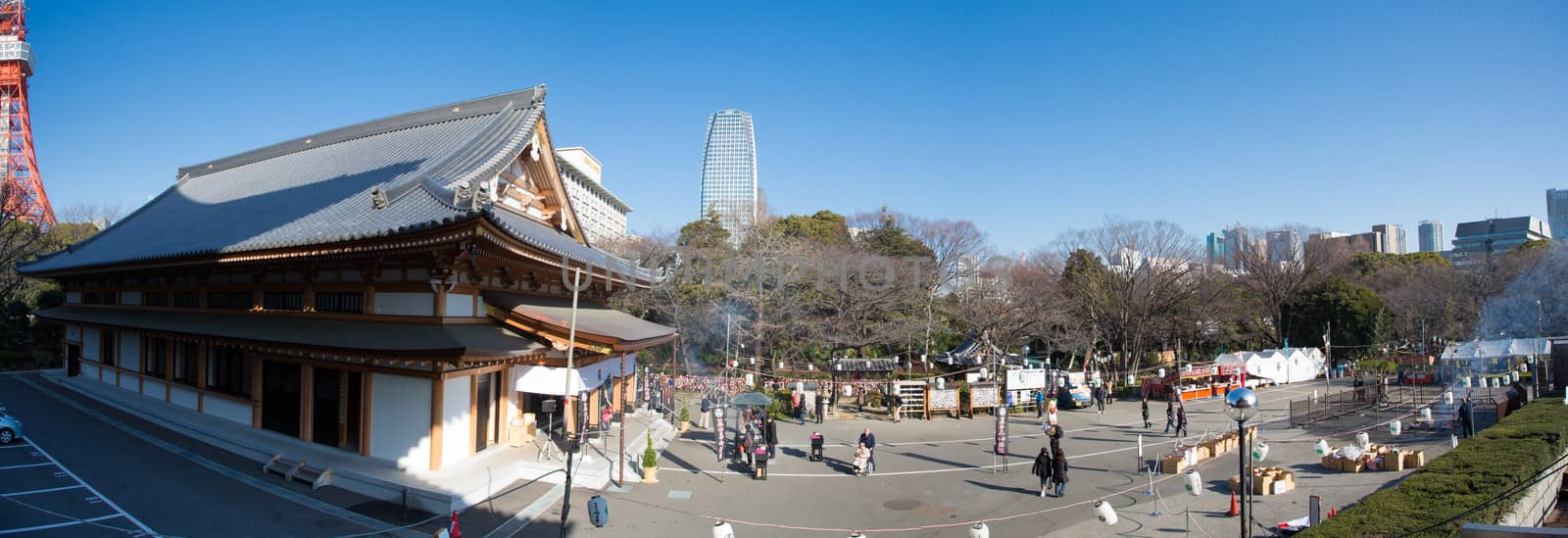 TOKYO, JAPAN, JANUARY 1: Zojoji temple, worshipers and Tokyo tower in Minato-ku, Tokyo, Japan 2013.