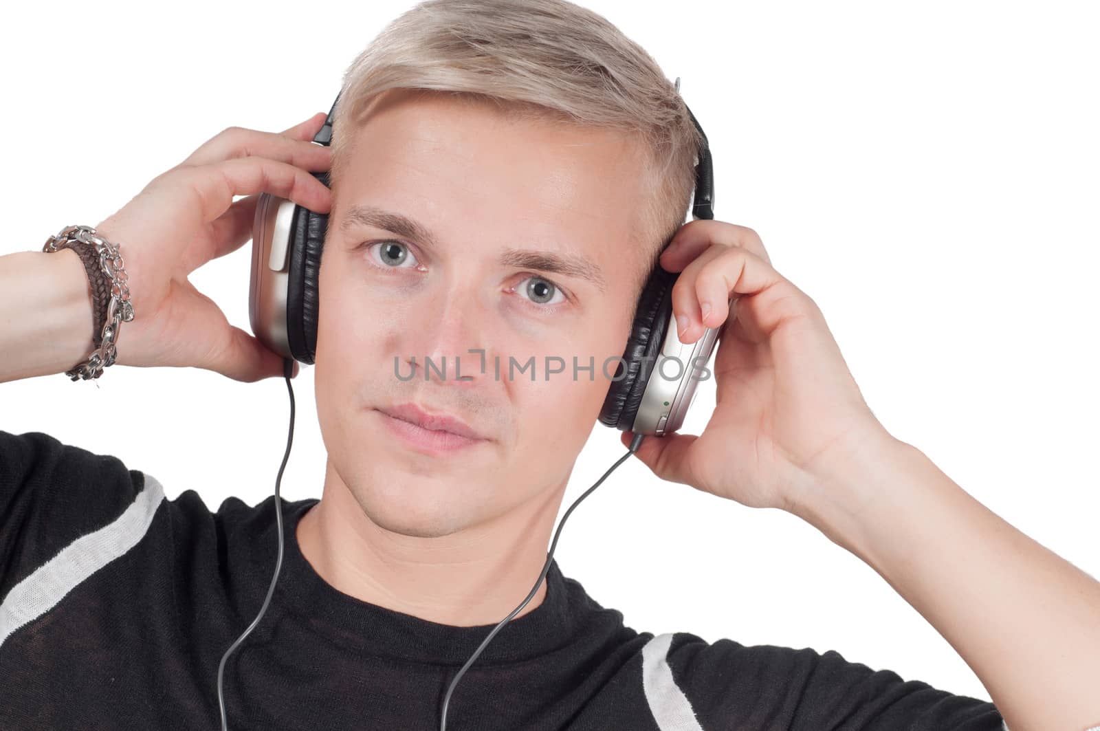 Young man in headphones isolated on white