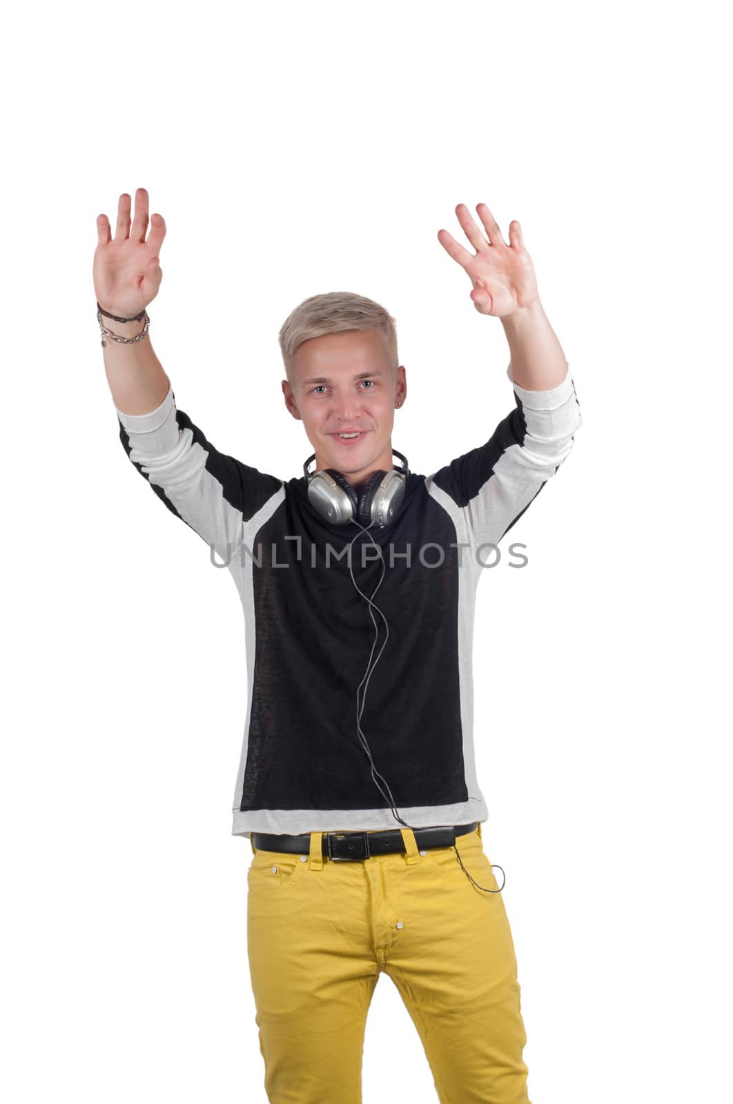 Man with headphones raising his hands up by anytka