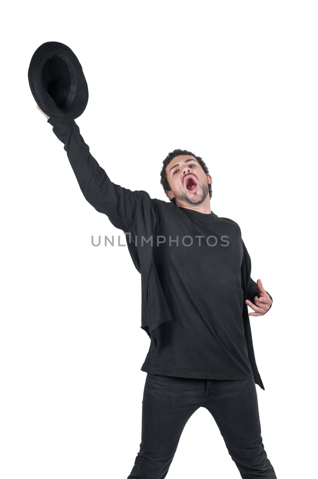 Young man with hat in hand yelling by anytka