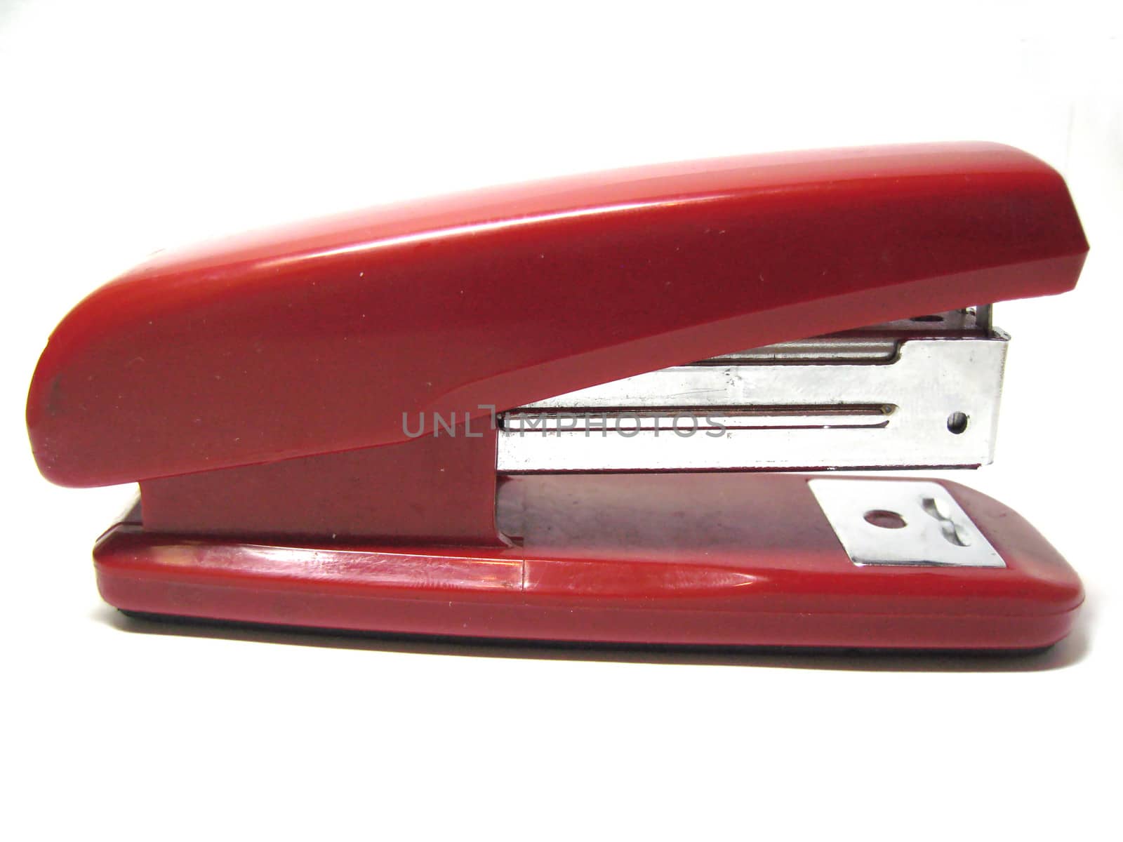Red stapler isolated on the white background