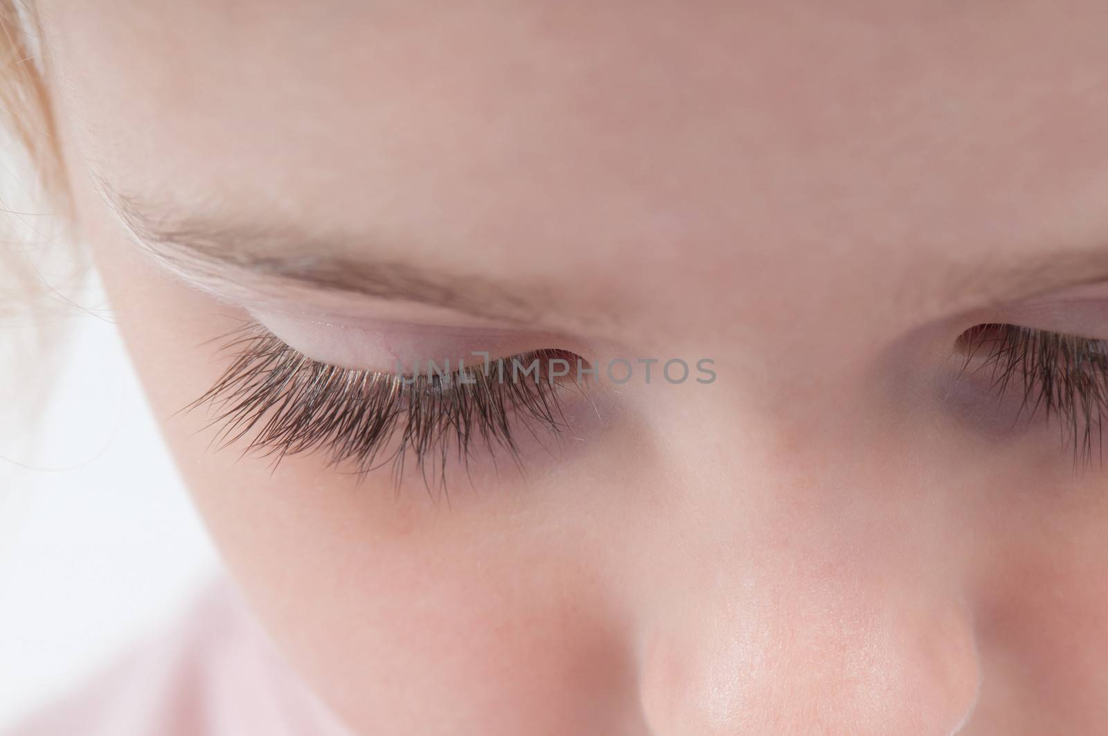 Closeup shot of beautiful long girl's eyelashes