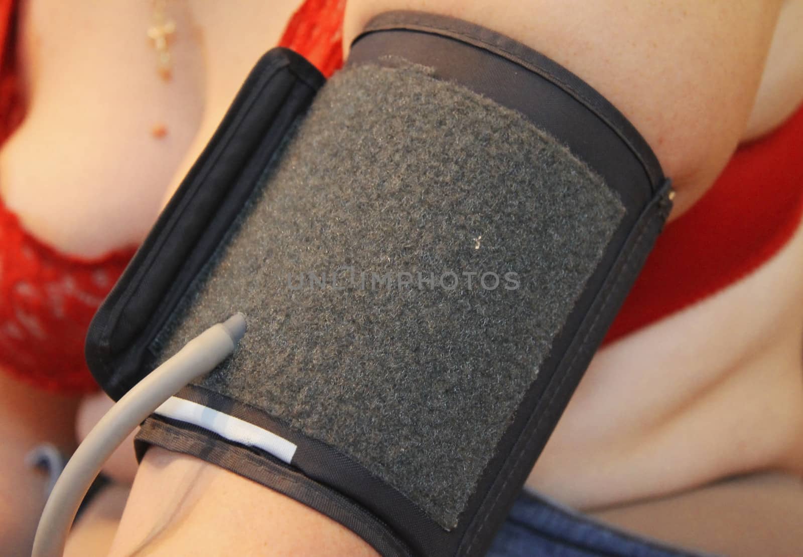 Blood presuure measuring on the female hand