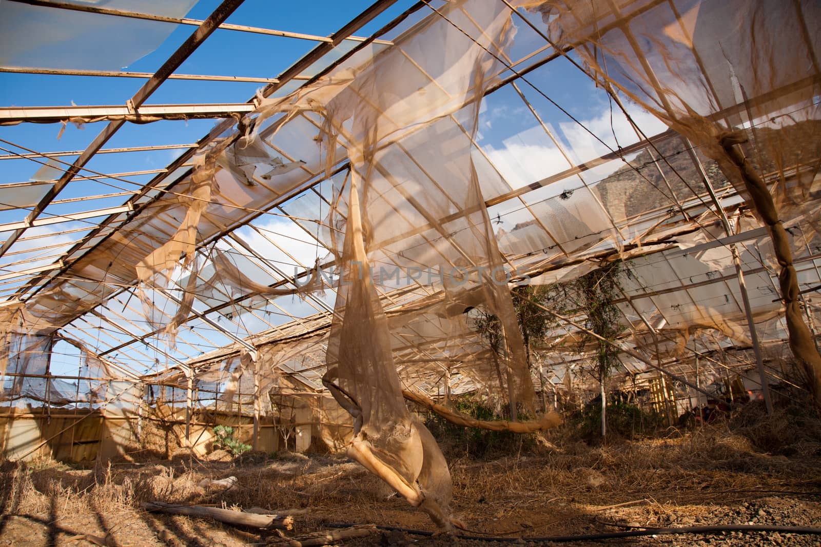 Abandoned and broken greenhouse in the countryside of Tenerife in Spain