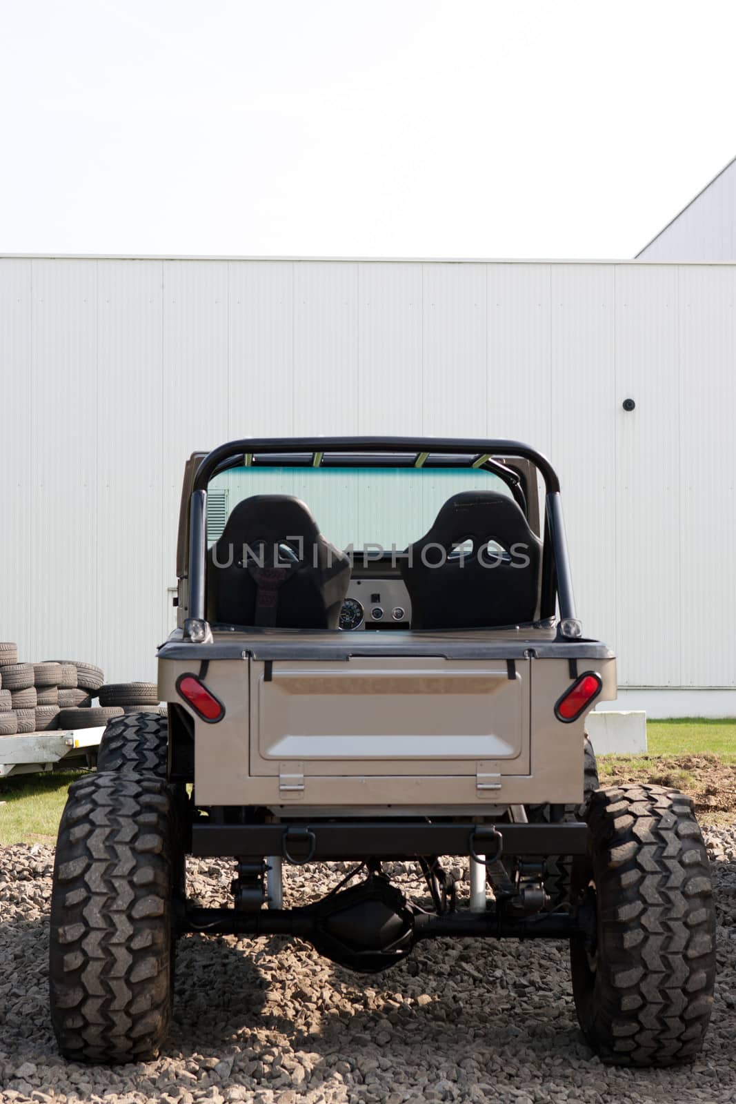 Back of a vintage four-wheel drive vehicle.