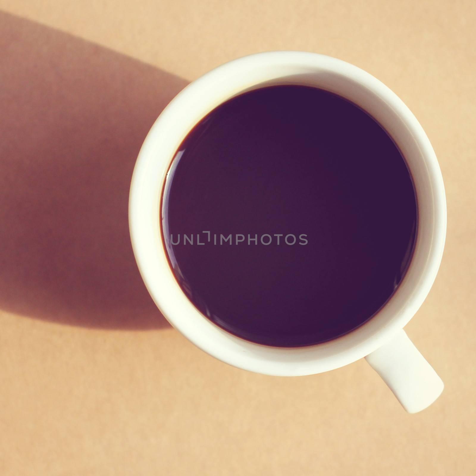 Black coffee with light and shadow, retro filter effect  by nuchylee