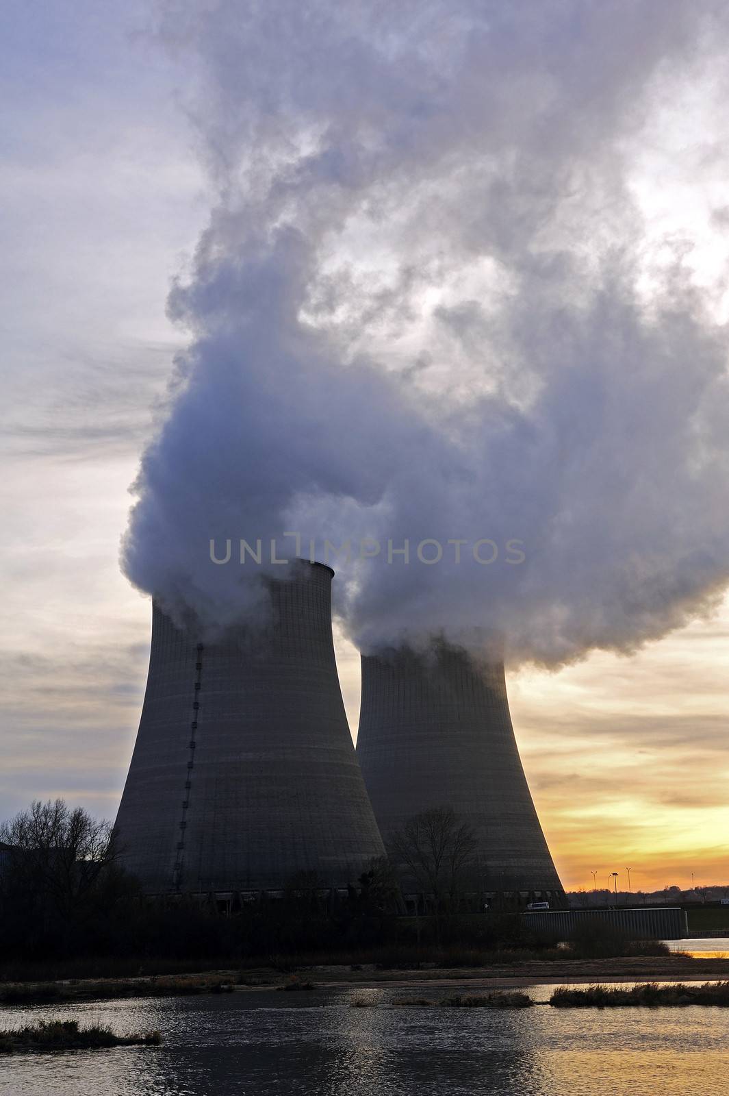 Nuclear power station in France on background sunset