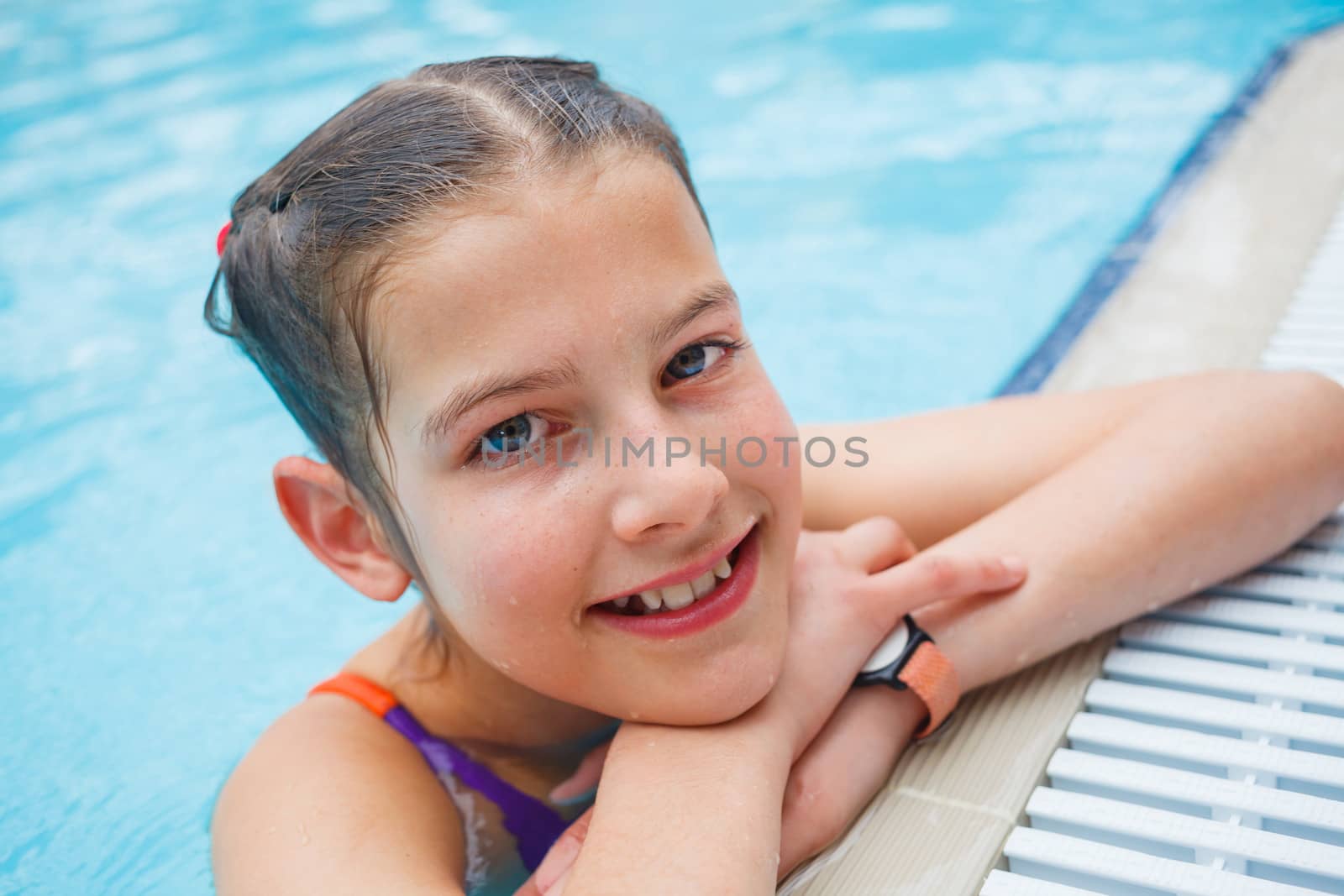 Activities on the pool. Cute girl in swimming pool