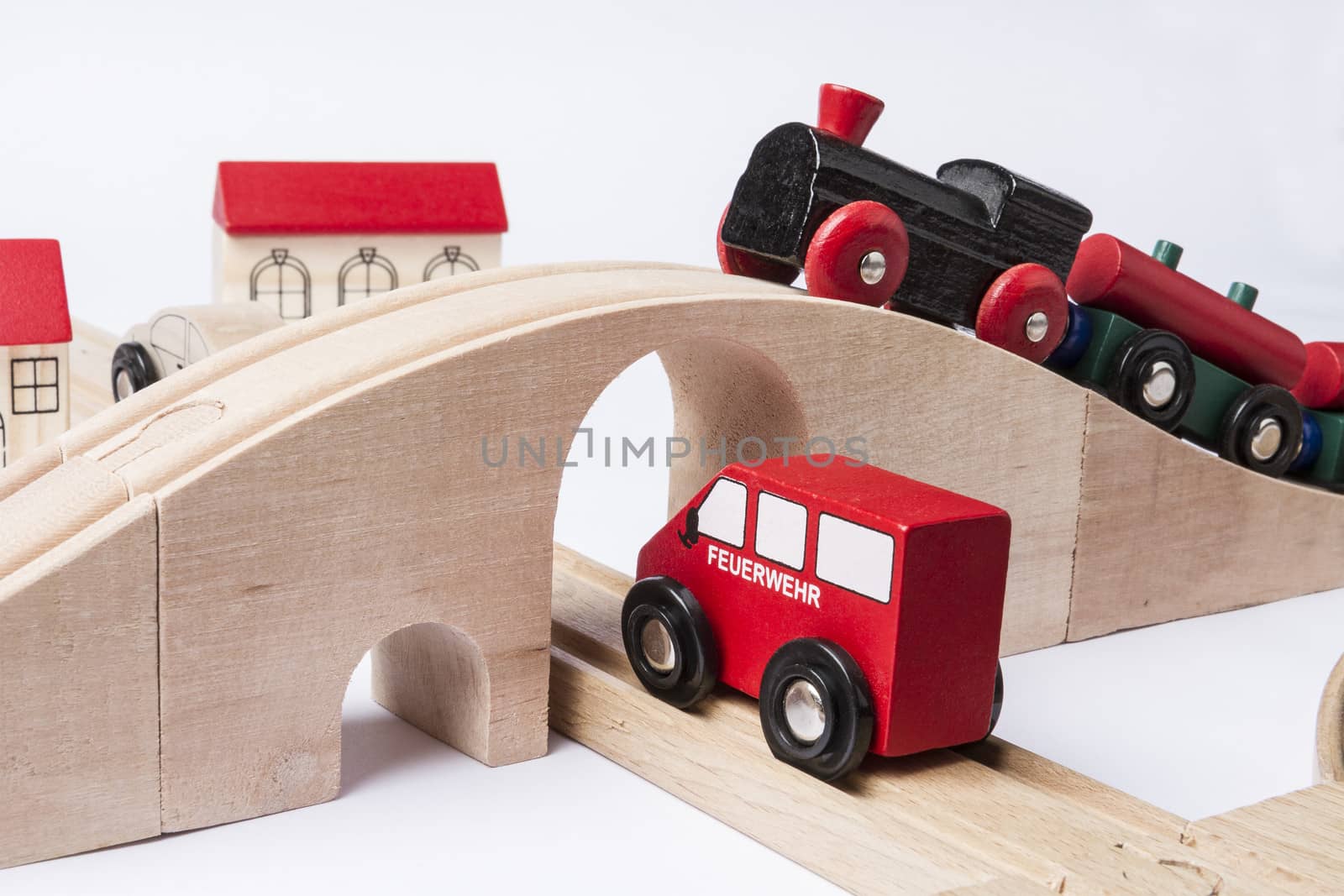 toy traffic with car and train isolated on grey background. horizontal image