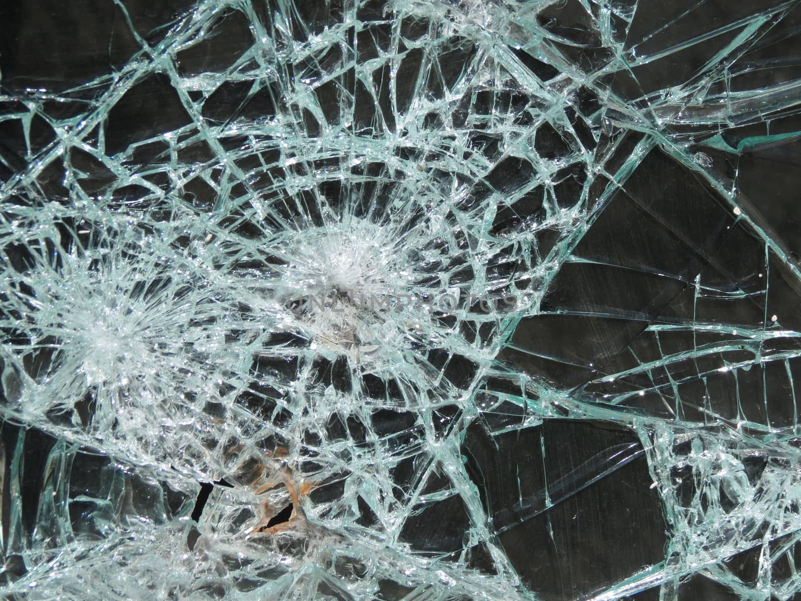 Smashed window glass useful as risk or danger concept