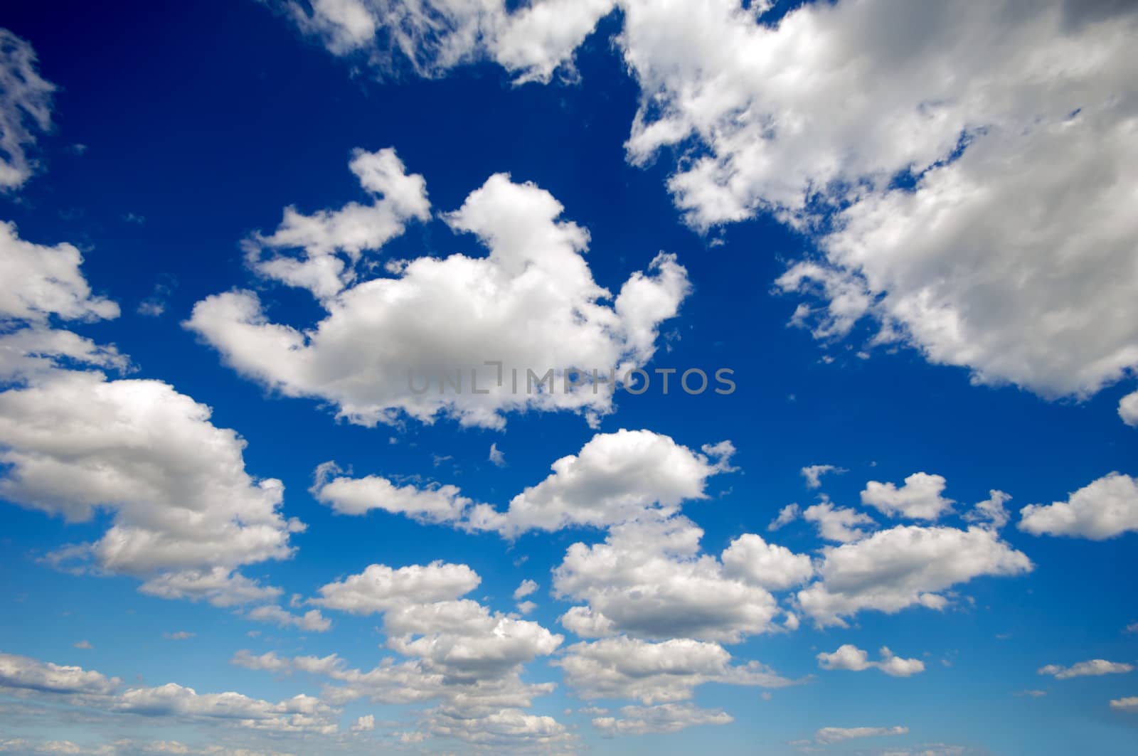 Cloudscape with cumulus clouds and blue sky