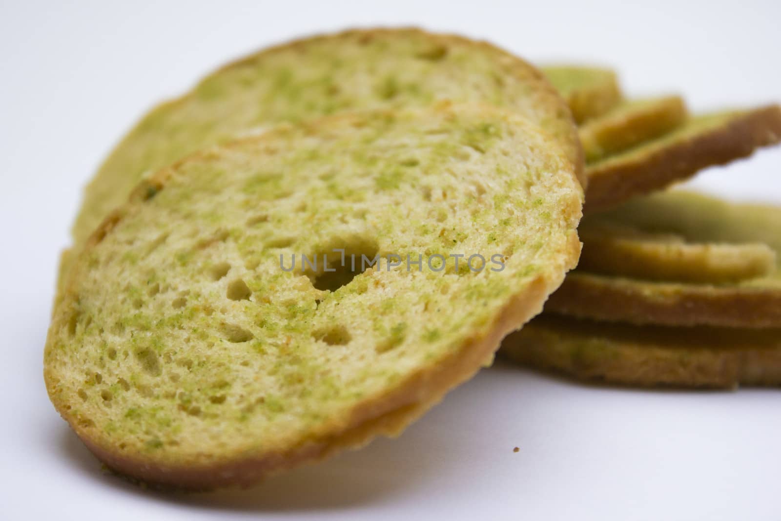 Healthy bruschettas baked with green herbs.