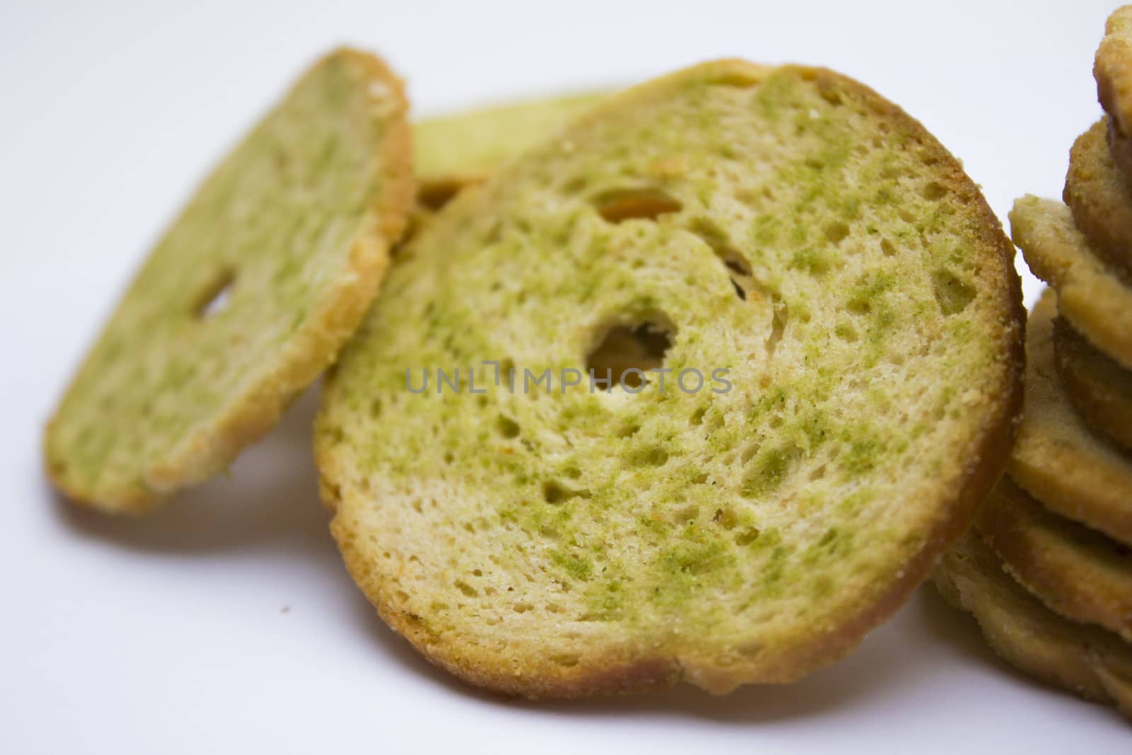 Healthy bruschettas baked with green herbs.