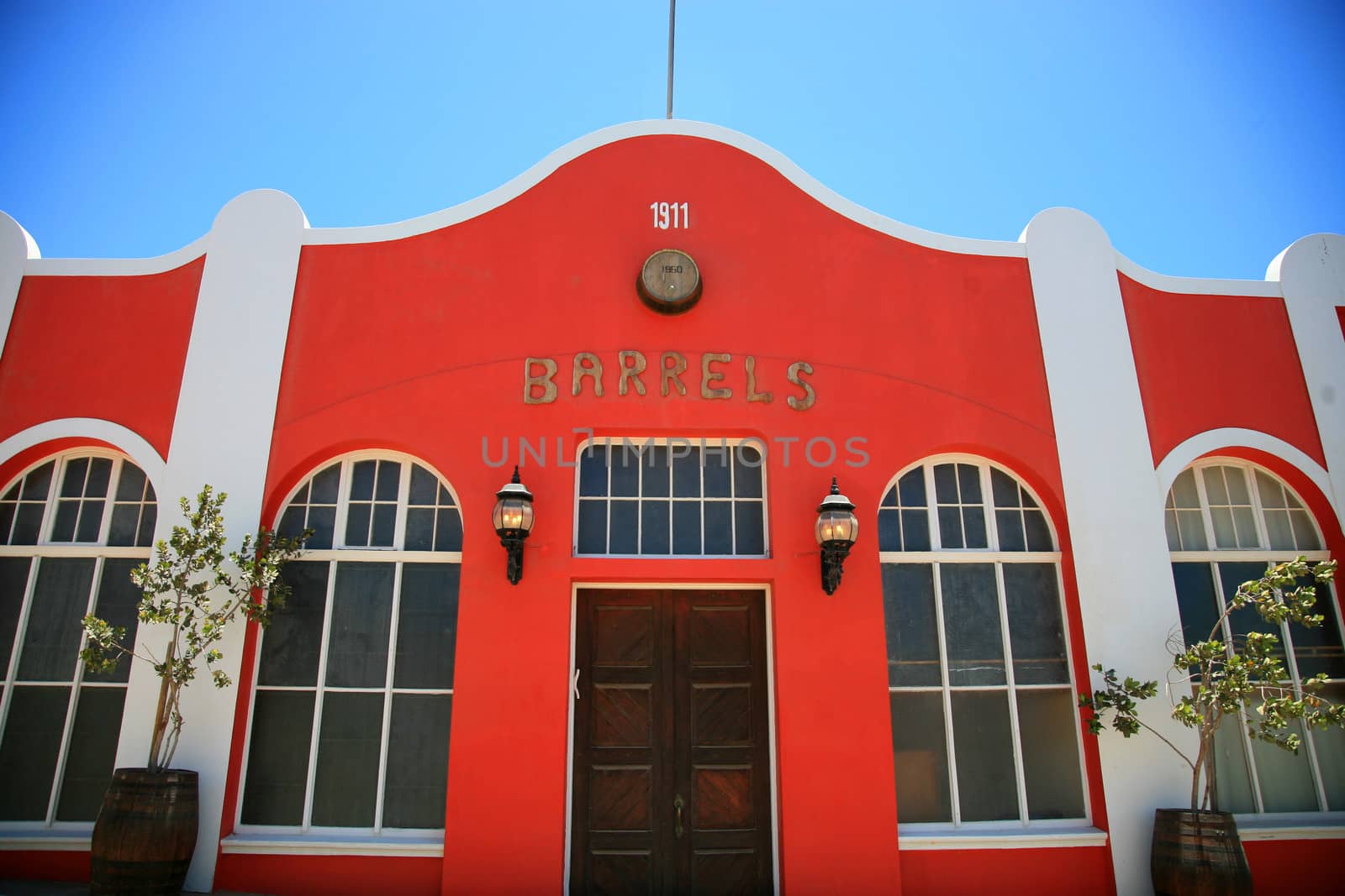 Red house traditional house with a blue sky in Luderitz, a harbor town in south-west Namibia, lying on one of the least hospitable coasts in Africa.