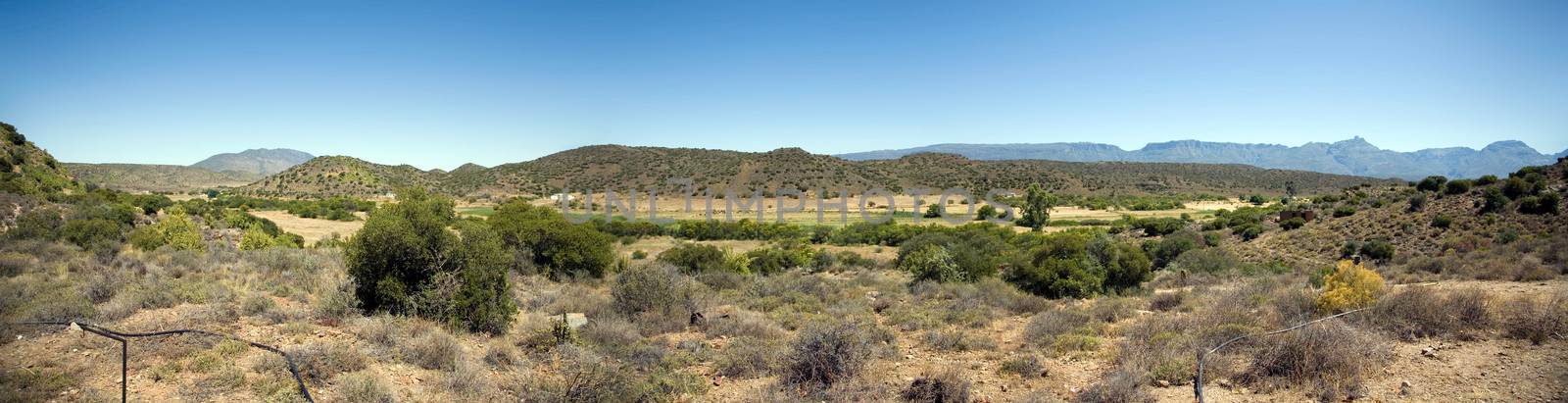 Arid karoo landscape showing characteristic hills by watchtheworld