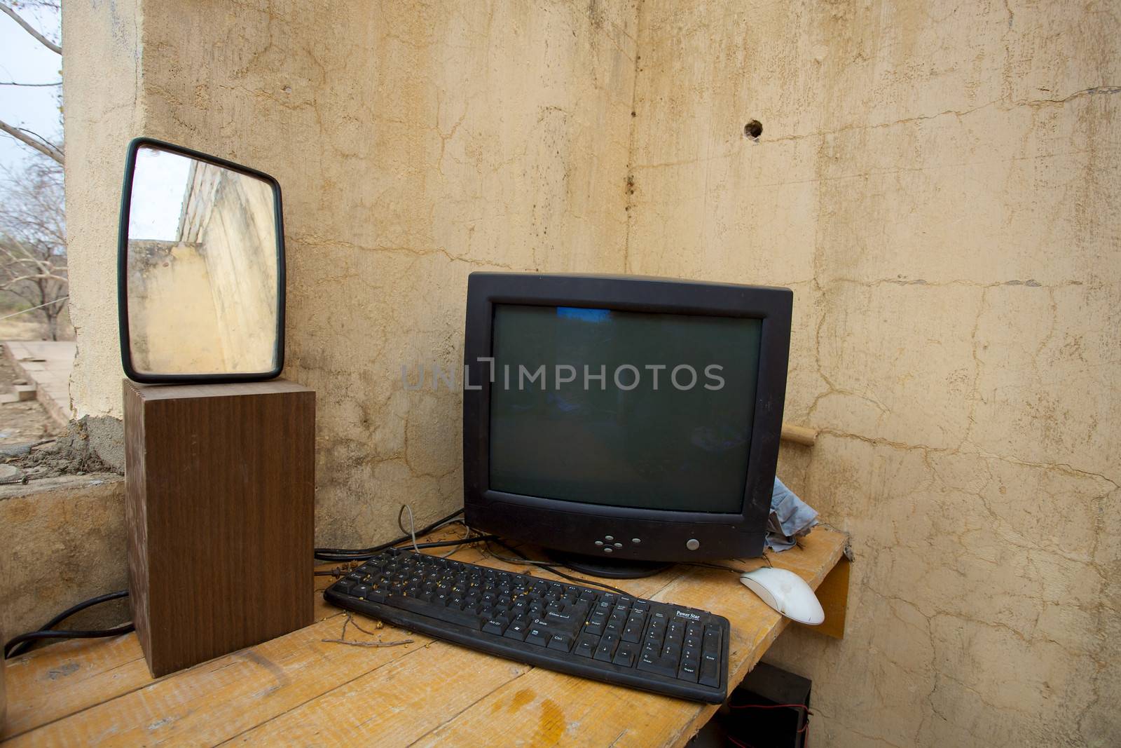 Old computer on desk by watchtheworld