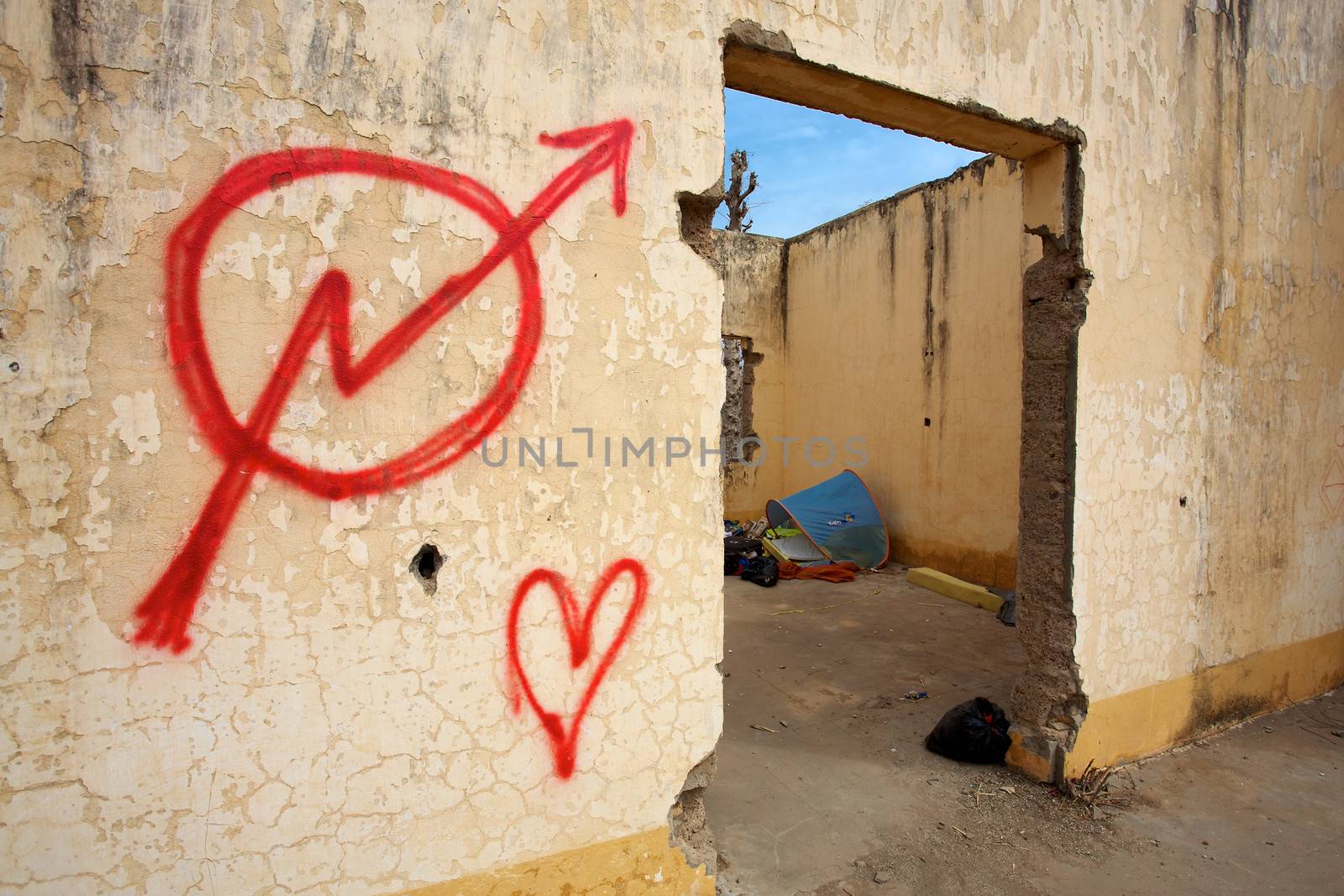 Gouina brand, big sign on a wall in a abandoned house in Mali