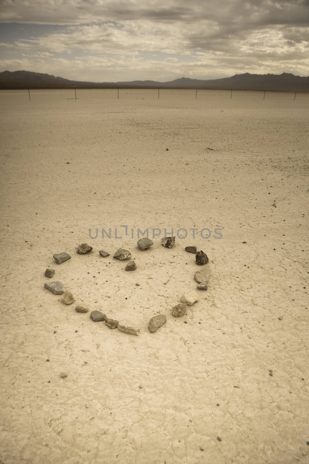 Heart shape made with stone in the desert of Nevada. Retro style image