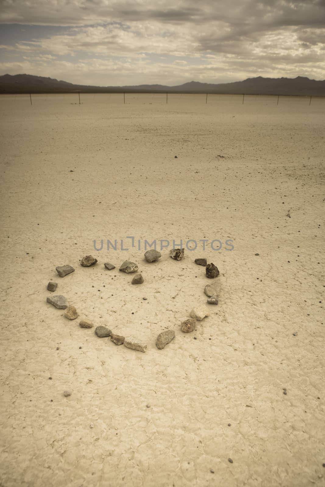 Heart shape made with stone in the desert of Nevada. Retro style image