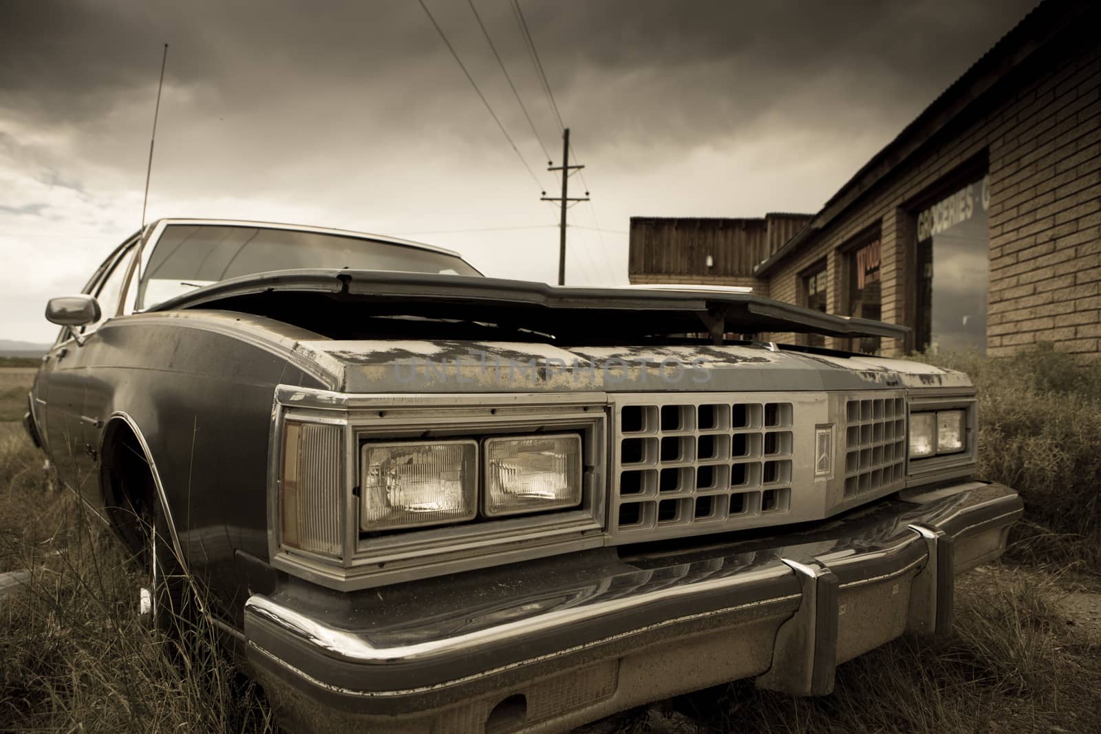 Old abandoned car by watchtheworld