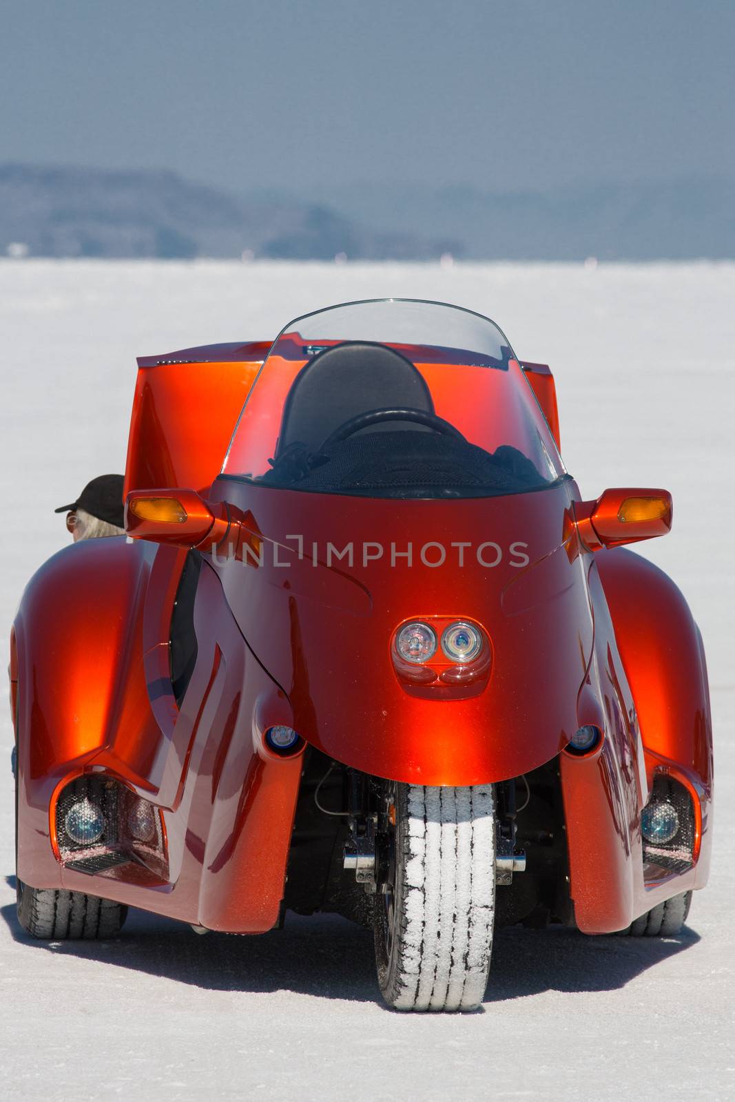 BONNEVILLE SALT FLATS, UTAH, SEPTEMBER 8: Unbranded strange orange motorbike during the World of Speed 2012. It looks like a confortable tricycle with a big engine. United States 2012.